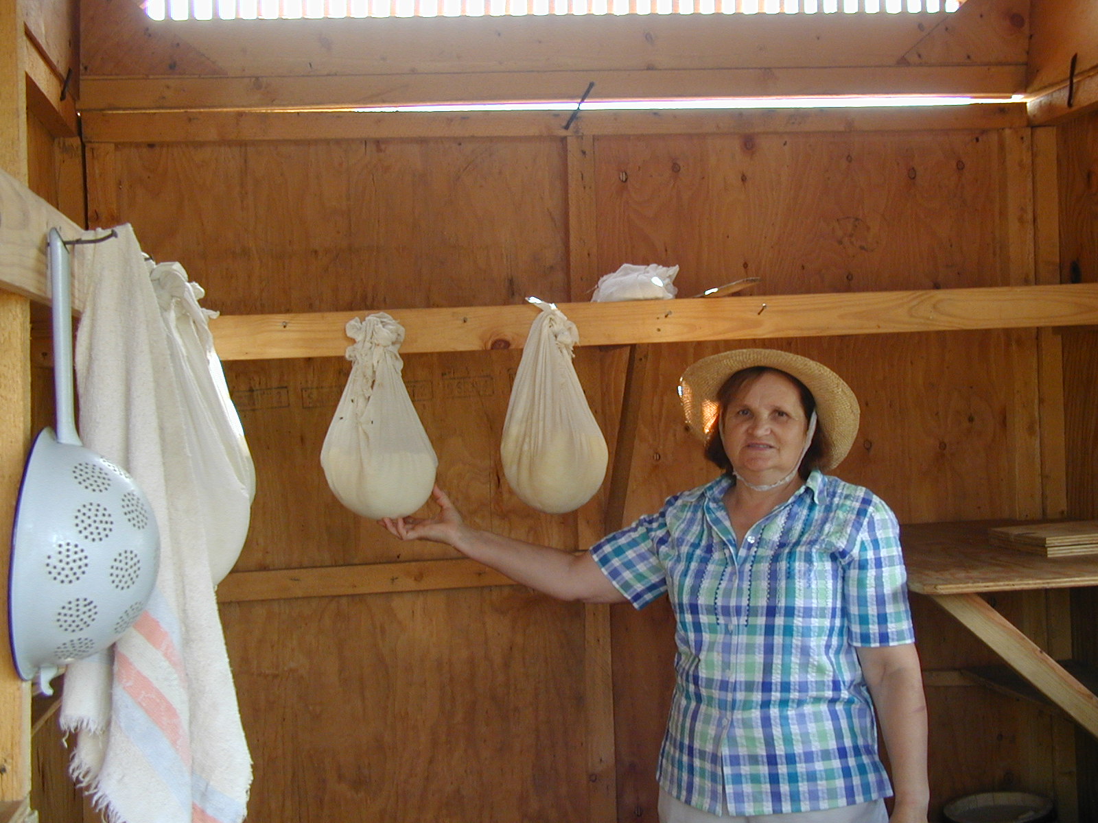 Aurica proudly shows us the home made cheeze from our farm.